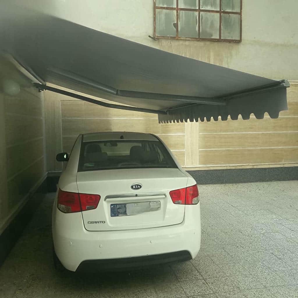 سایبان برقی بازویی با پوشش پارچه ای